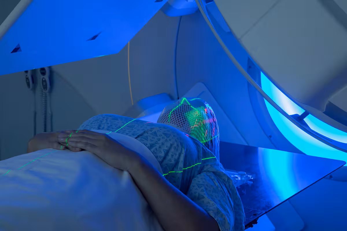 Woman receiving radiotherapy for cancer in a private hospital using health insurance